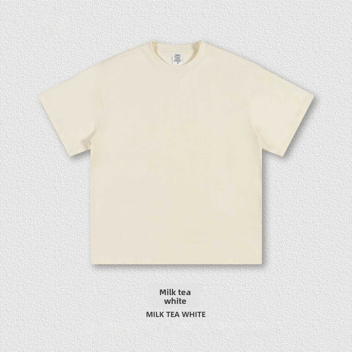 Flat lay of the heavyweight 305g cotton crew neck tee showing the boxy oversized cut and ribbed collar