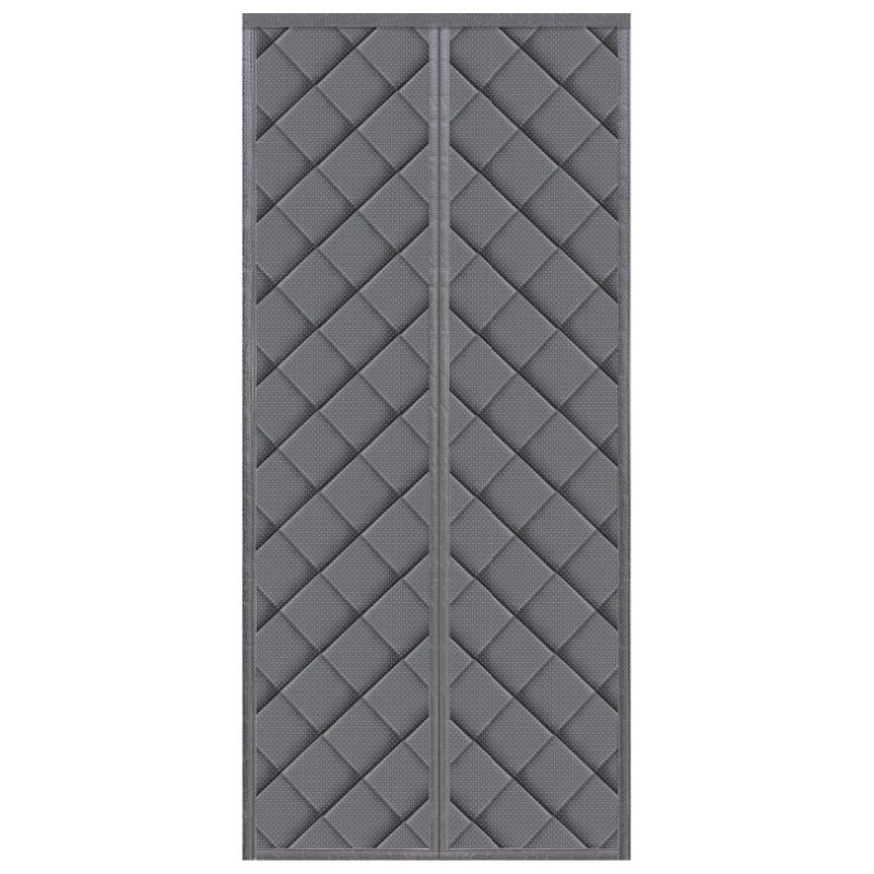 gray door curtain sealing a doorway to block winter drafts and hold warmth