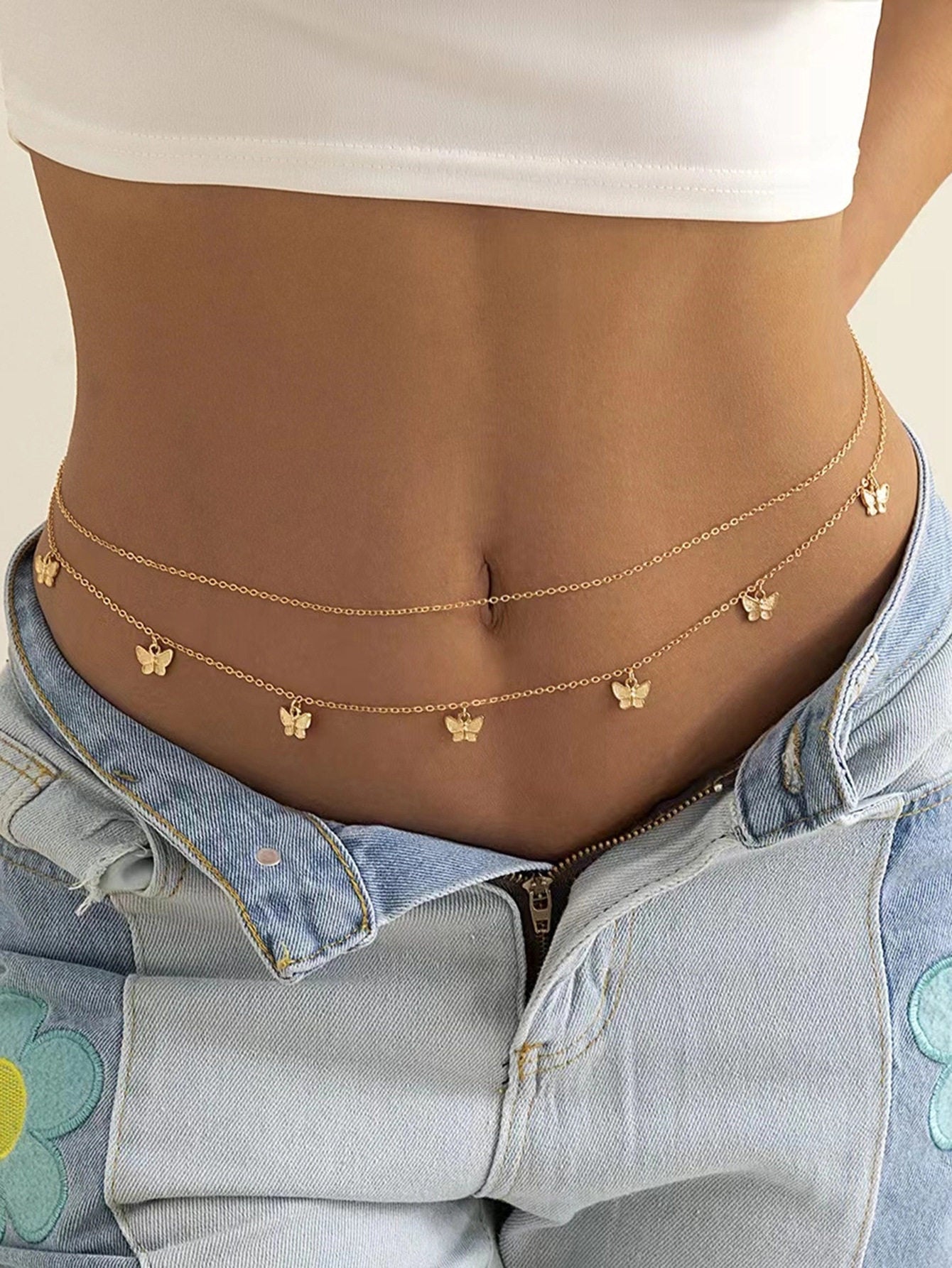 One of the waist chain designs in this range, photographed worn low across the waist
