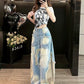 Light washed blue wide leg baggy jeans with frayed patch appliques worn by a woman, full length front view
