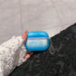 White glow in the dark AirPods case with pale luminous top