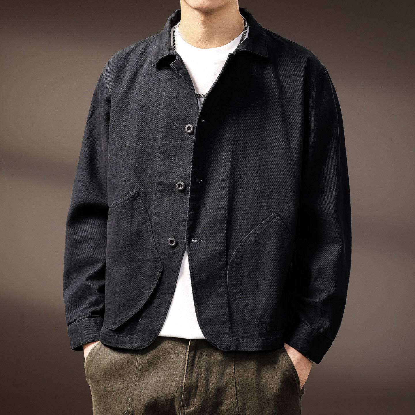 Workwear shirt jacket laid flat showing two chest flap pockets and the full button front