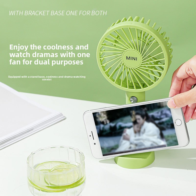 Close up of the handheld fan grille, soft blades and molded shell texture