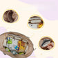 Diaper bag interior packed with nappies, bottles and toys, showing the mesh pocket and foil lined pocket