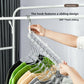 Clear nine-hole plastic hanger rack with sliding hook head hung from a rail with colorful shirts