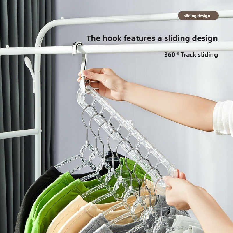 Clear nine-hole plastic hanger rack with sliding hook head hung from a rail with colorful shirts