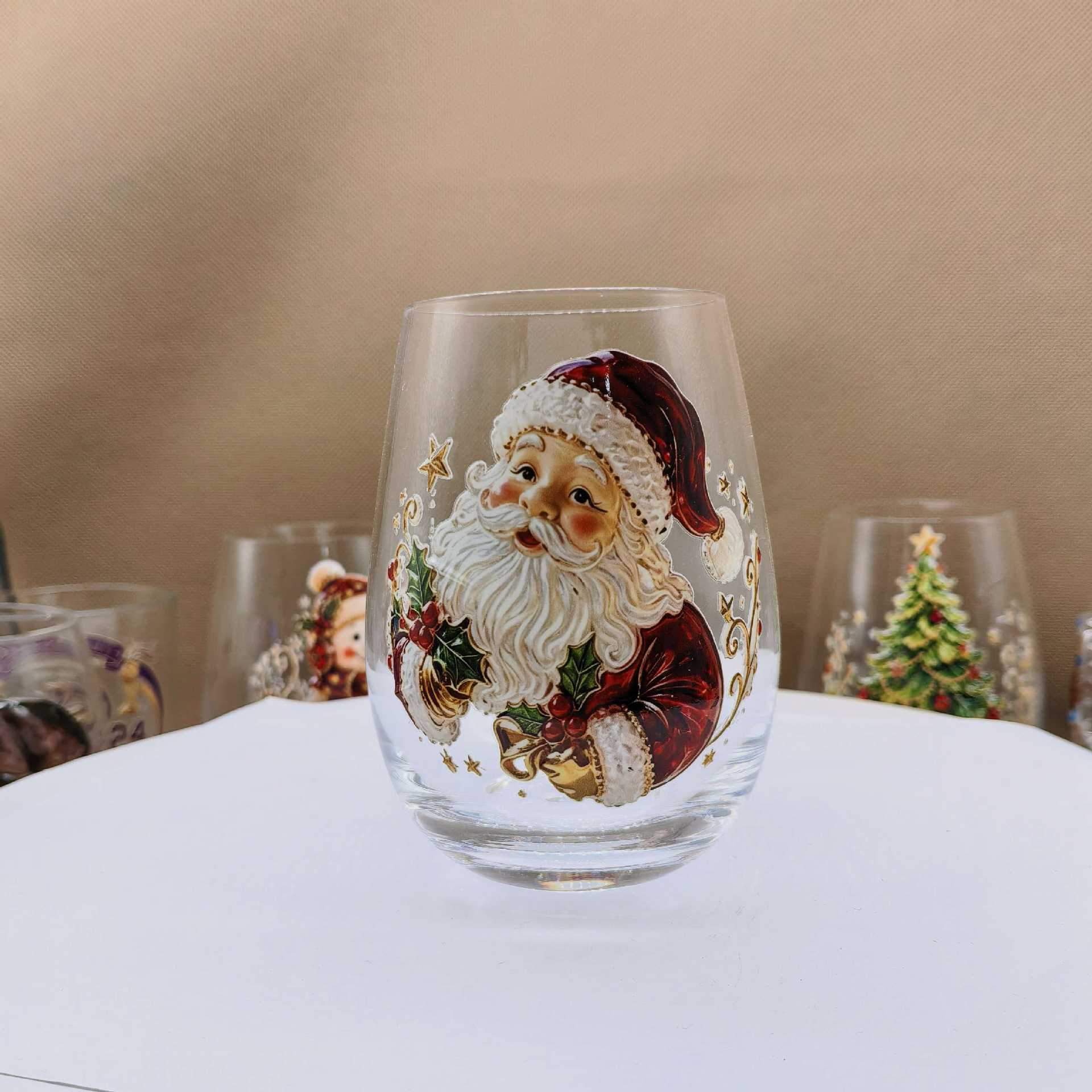 Clear borosilicate Christmas glass cup with a raised painted flat Santa holiday motif