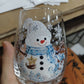 Clear borosilicate Christmas glass cup with a raised painted flat blue snowman holiday motif