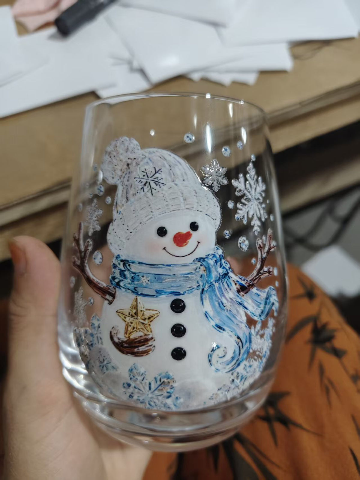 Clear borosilicate Christmas glass cup with a raised painted flat blue snowman holiday motif