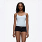 Slim scoop neck cami in a stretch knit worn with low rise jeans