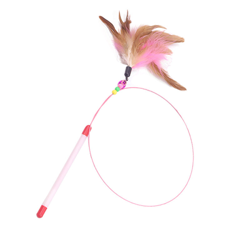 Pink handled cat teaser wand with a feather tuft, beads and bell on a coiled steel wire