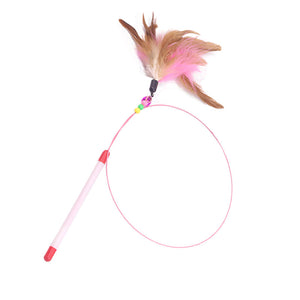 Pink handled cat teaser wand with a feather tuft, beads and bell on a coiled steel wire
