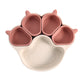 Beige bear paw plate with four small burgundy cups on a white background