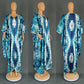Tie dye batwing kaftan maxi dress shown from the front with a deep V neckline and side slit