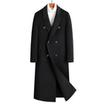 Black double breasted long wool blend coat on a wooden hanger over a white roll neck, front view