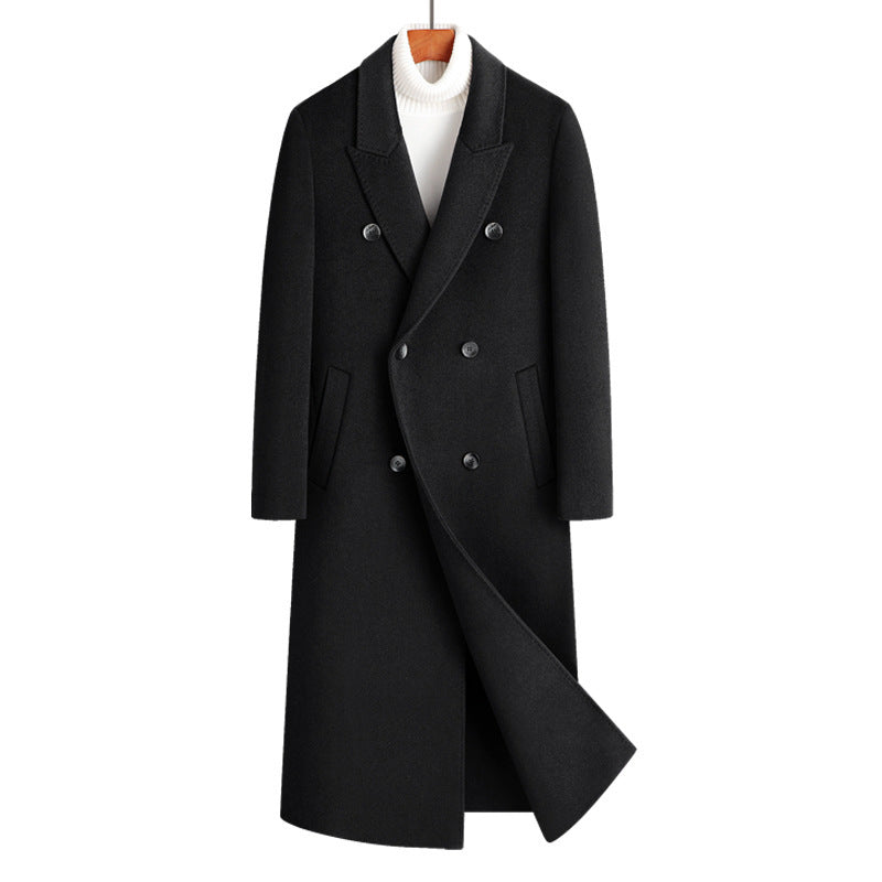 Black double breasted long wool blend coat on a wooden hanger over a white roll neck, front view