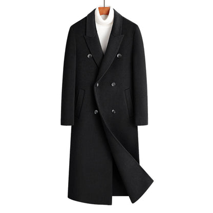 Black double breasted long wool blend coat on a wooden hanger over a white roll neck, front view