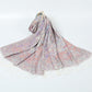 Ivory paisley jacquard scarf with pastel pink, blue and lilac pattern and cream tassel fringe