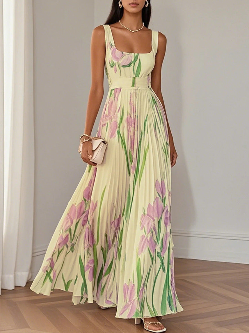 Pleated floral maxi dress worn in a warm-weather styled scene