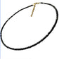 Clear faceted glass bead choker necklace with a gold tone lobster clasp