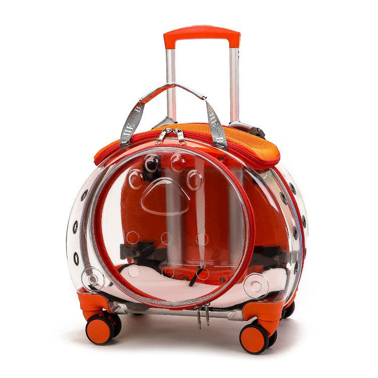 Transparent orange pet carrier on wheels with orange trim, an orange telescopic handle and a round clear door