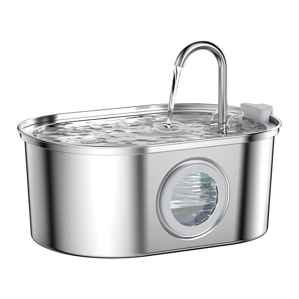 Round steel pet fountain with T shaped spout and dome of water rising over the tray