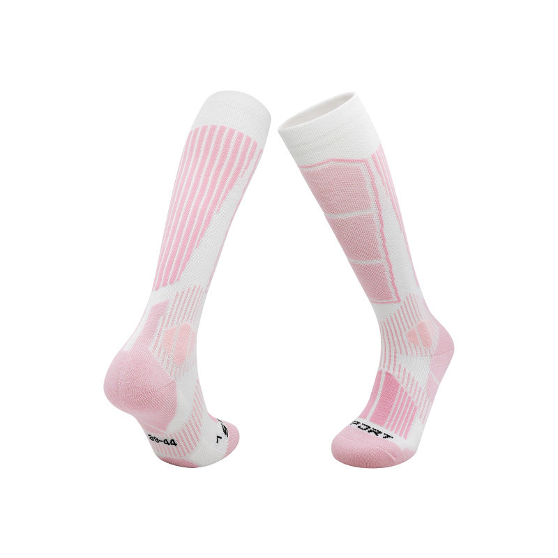 Thick knit ski socks with an arrow pattern up the shin and a padded footbed on white