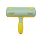 Option Emerald green: pet hair roller with a mint green head, yellow handle and two thumb grooves on white