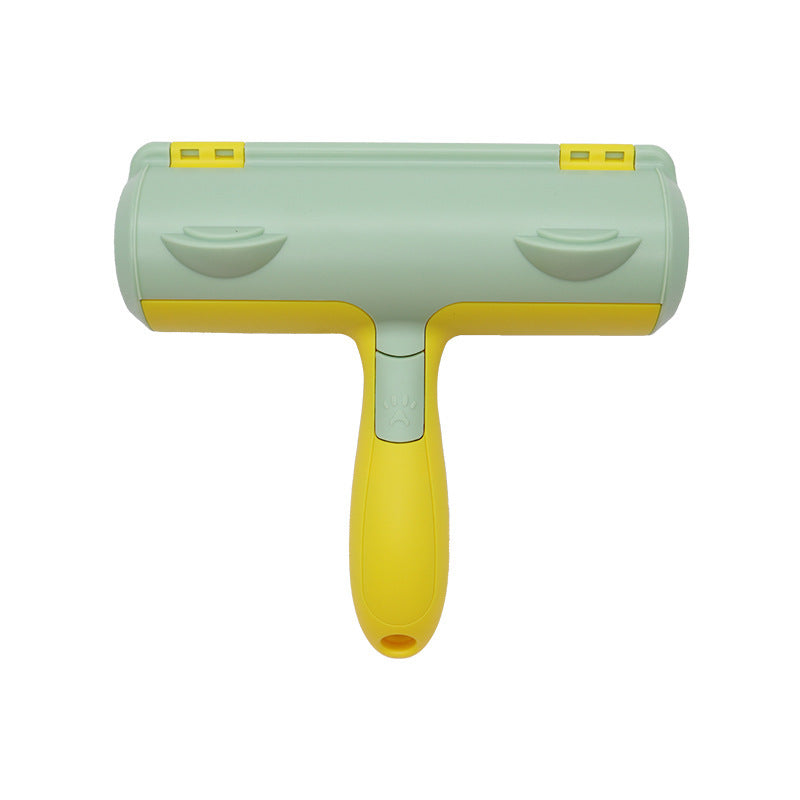 Option Emerald green: pet hair roller with a mint green head, yellow handle and two thumb grooves on white