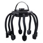 Black scalp massager with a top carry loop and eight flexible black claws