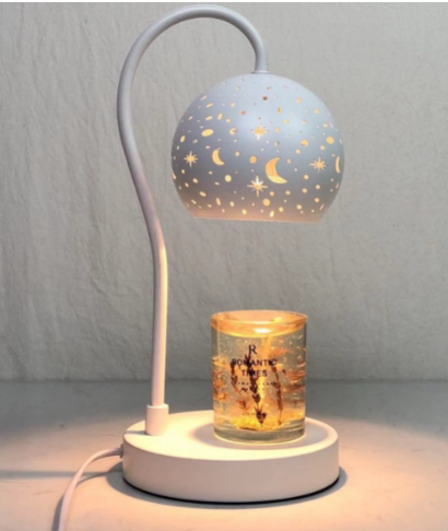 Star and moon pierced ceramic shade on a candle warmer lamp