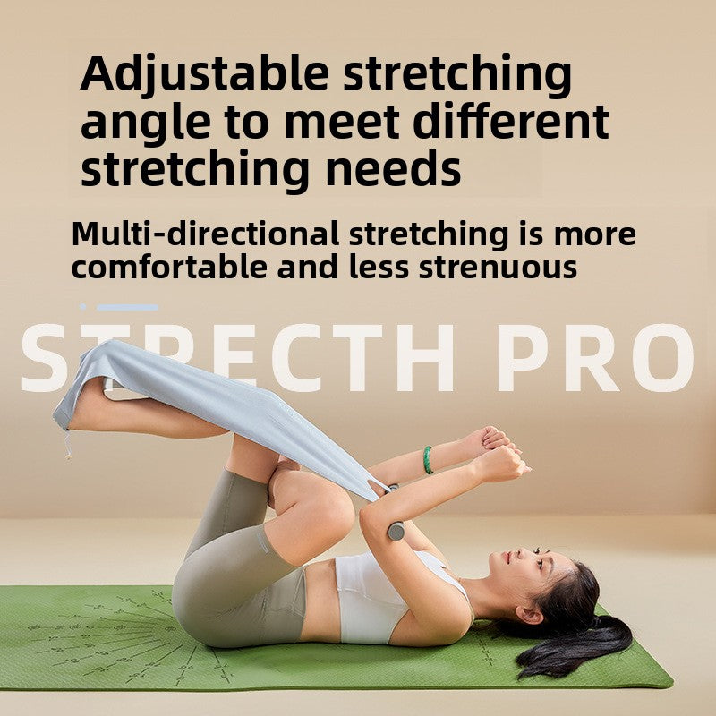 Wide fabric yoga stretching strap with a bar handle and a foot loop rolled up to show how it packs down