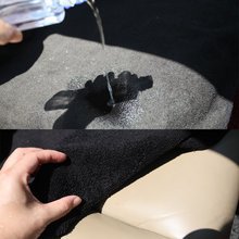 Waterproof pet car seat cover shown fitted over a rear bench seat with straps