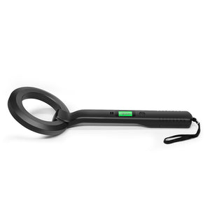 Black ring coil metal detector wand lying flat with green LCD indicator and wrist strap