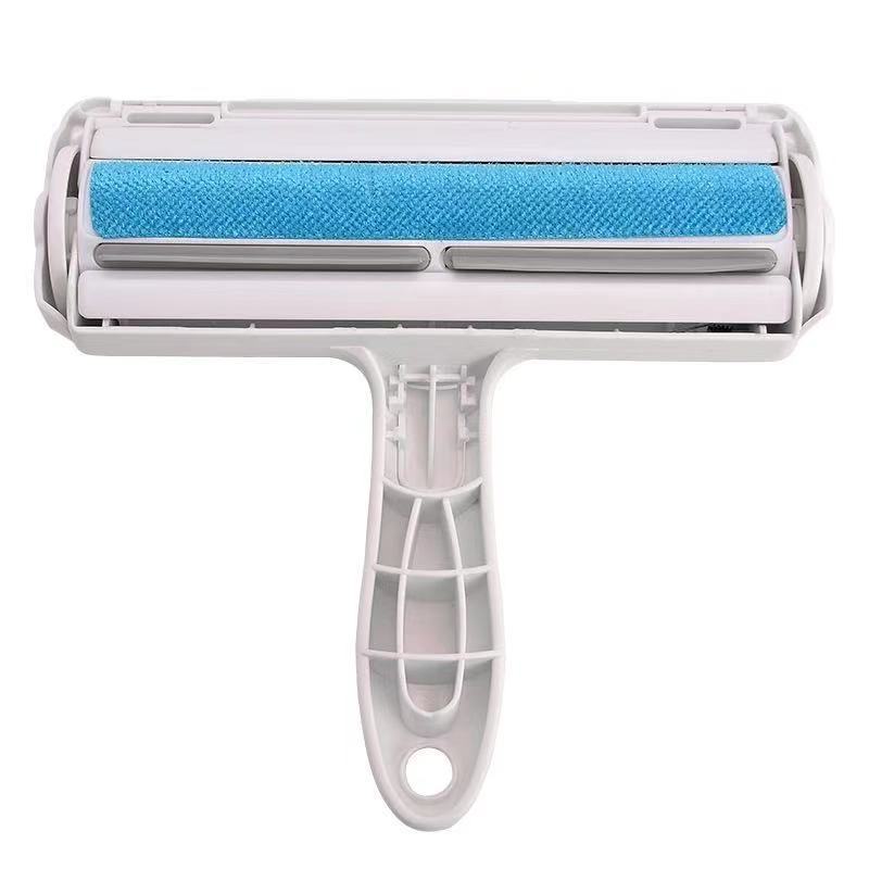 Red reusable pet hair remover roller shown from the side with slim handle