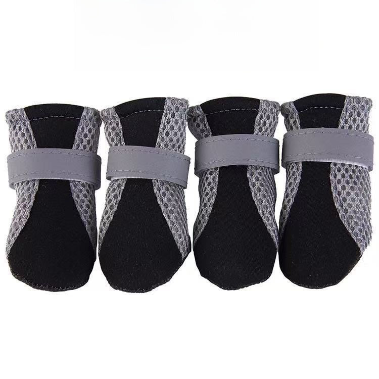 Mesh dog shoe sole close up showing the moulded anti-slip grip pattern