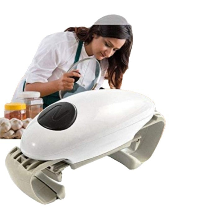 A woman uses a white electric automatic jar opener to twist a lid loose in a kitchen