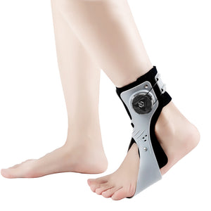 Grey and black ankle brace with a tightening dial worn on a bare foot