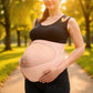 Side angle of the maternity belt wrapped under a pregnancy bump