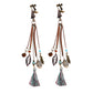 Bohemian vintage clip-on tassel drop earrings on a zinc alloy frame, handmade boho pair on white studio background