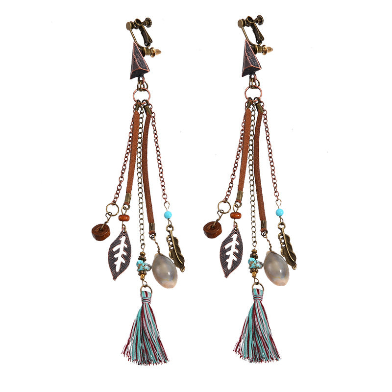 Bohemian vintage clip-on tassel drop earrings on a zinc alloy frame, handmade boho pair on white studio background