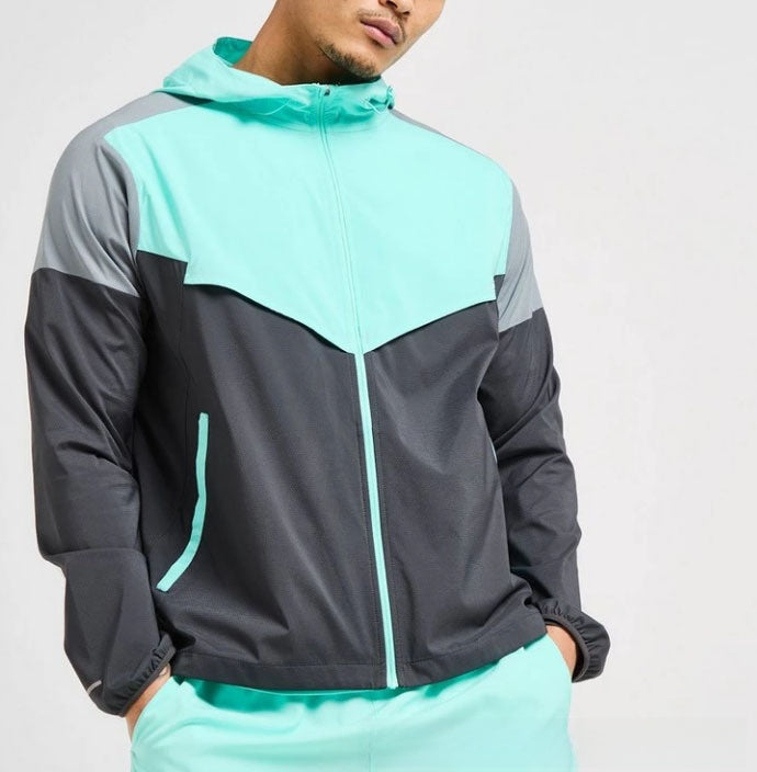 Colour block hooded sports jacket and shorts set laid out showing both pieces together