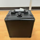 Black aluminium card storage case with folding carry handle and front latch, side view