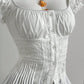 Close up of the waist: openwork lace insertion bands, pintucks, button placket and knife pleated peplum