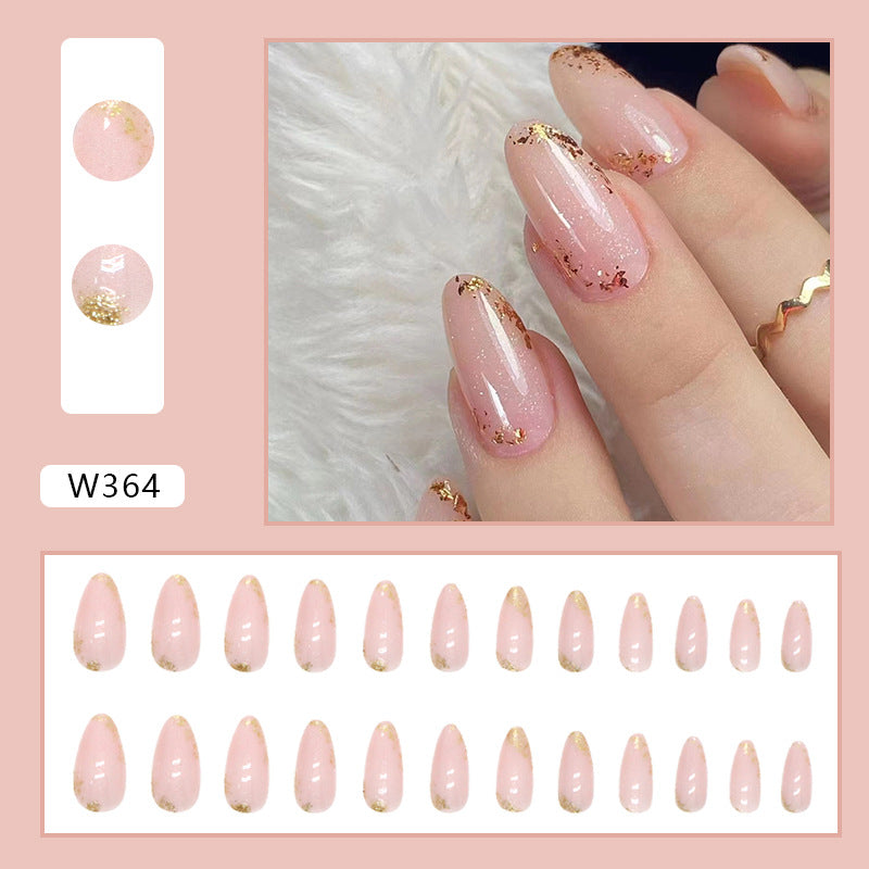 Full cover press-on almond nails shown in several designs, glossy finish shown on a hand