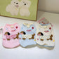 Sleeveless small dog vest with a back leash D-ring and a dachshund applique showing the back D-ring for a leash