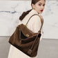 Angled hero shot of the frosted suede leather tote bag in coffee tone