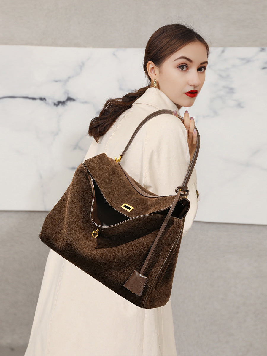 Angled hero shot of the frosted suede leather tote bag in coffee tone