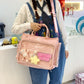 Solid color nylon shoulder bag with a transparent display pocket and zip closure