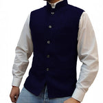 Navy blue herringbone stand collar vest worn over a white shirt and jeans